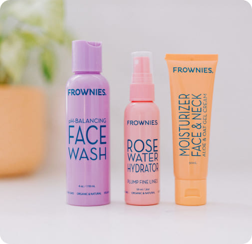 line up of frownies skincare products on a counter