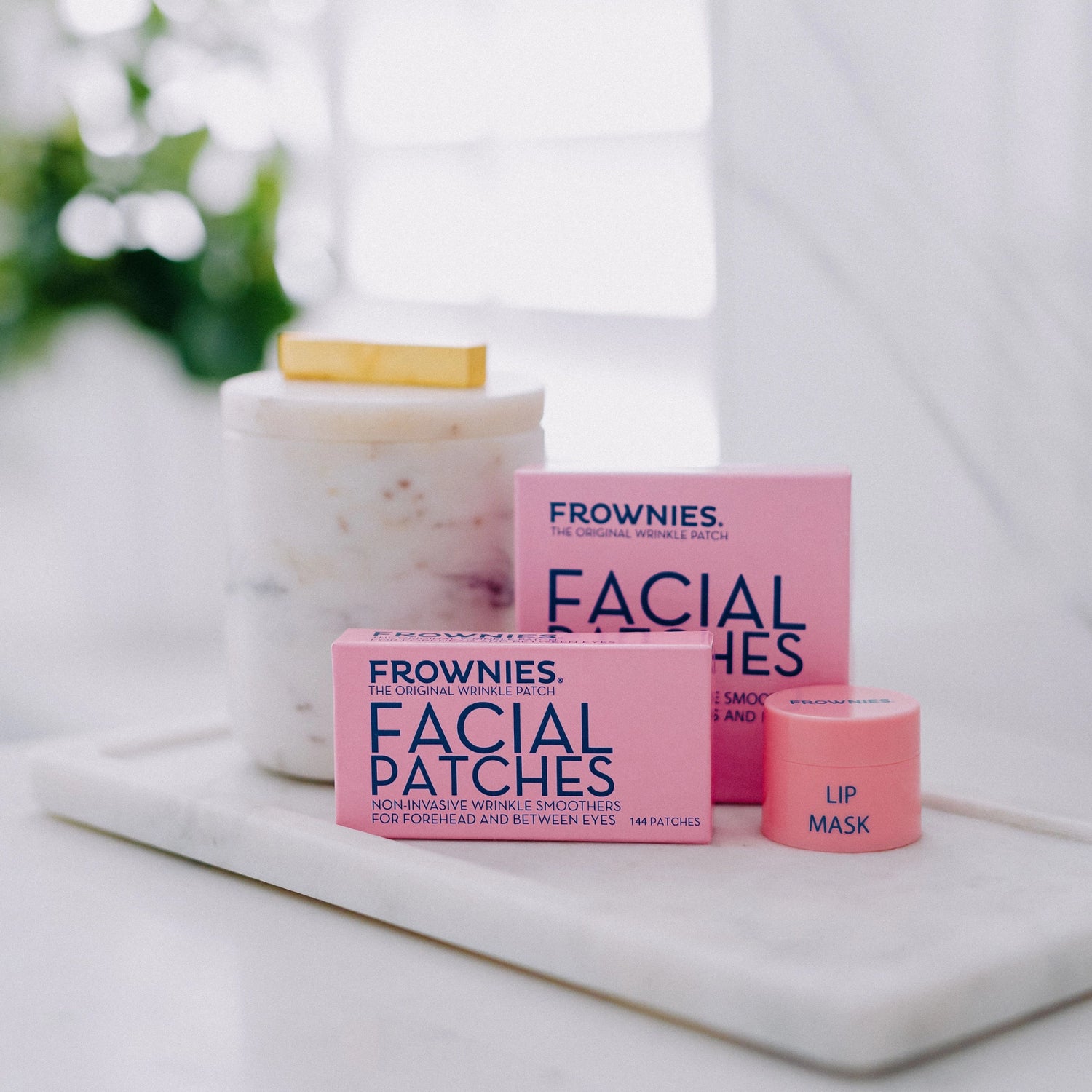 A picture of Frownies facial patches (FBE and CEM) with Frownies Lip Mask also shown in the picture.