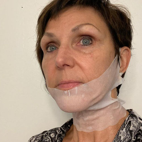 woman with short dark hair wearing CHIN-UP Peptide Neck and Chin Mask  The Frownies   