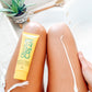 woman's legs with yellow tube of frownies Natural Firming and Toning Cream Skincare Products Frownies   