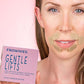 close up of woman's face wearing gentle lifts around mouth and holding a pink box of Gentle Lifts for Lip Lines Facial Patches Frownies   