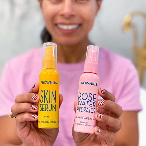 woman holding yellow bottle of vitamin c serum and pink bottle of rose water hydrator Frownies Skincare Basics  The Frownies   