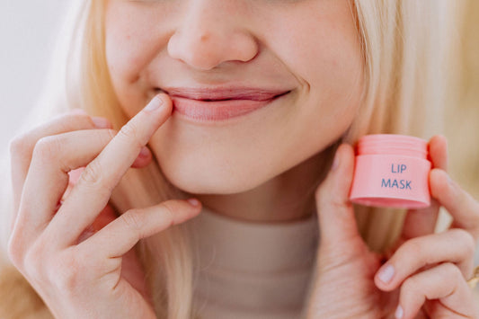 Woman smiling and applying Frownies Lip Mask to her mouth