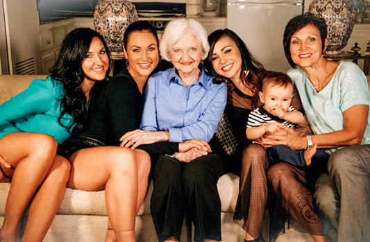 four generations of women including grandmother, mother, three daughters, and grand-daughter 