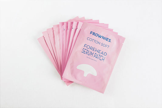 stack of ten pink packages of Serum Patch for Forehead Wrinkles Facial Patches Frownies 10-pack  