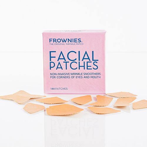 Frownies Original Facial Patches pink box with paper patches setting outside of the box. 
