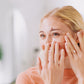 woman putting on under eye gels
