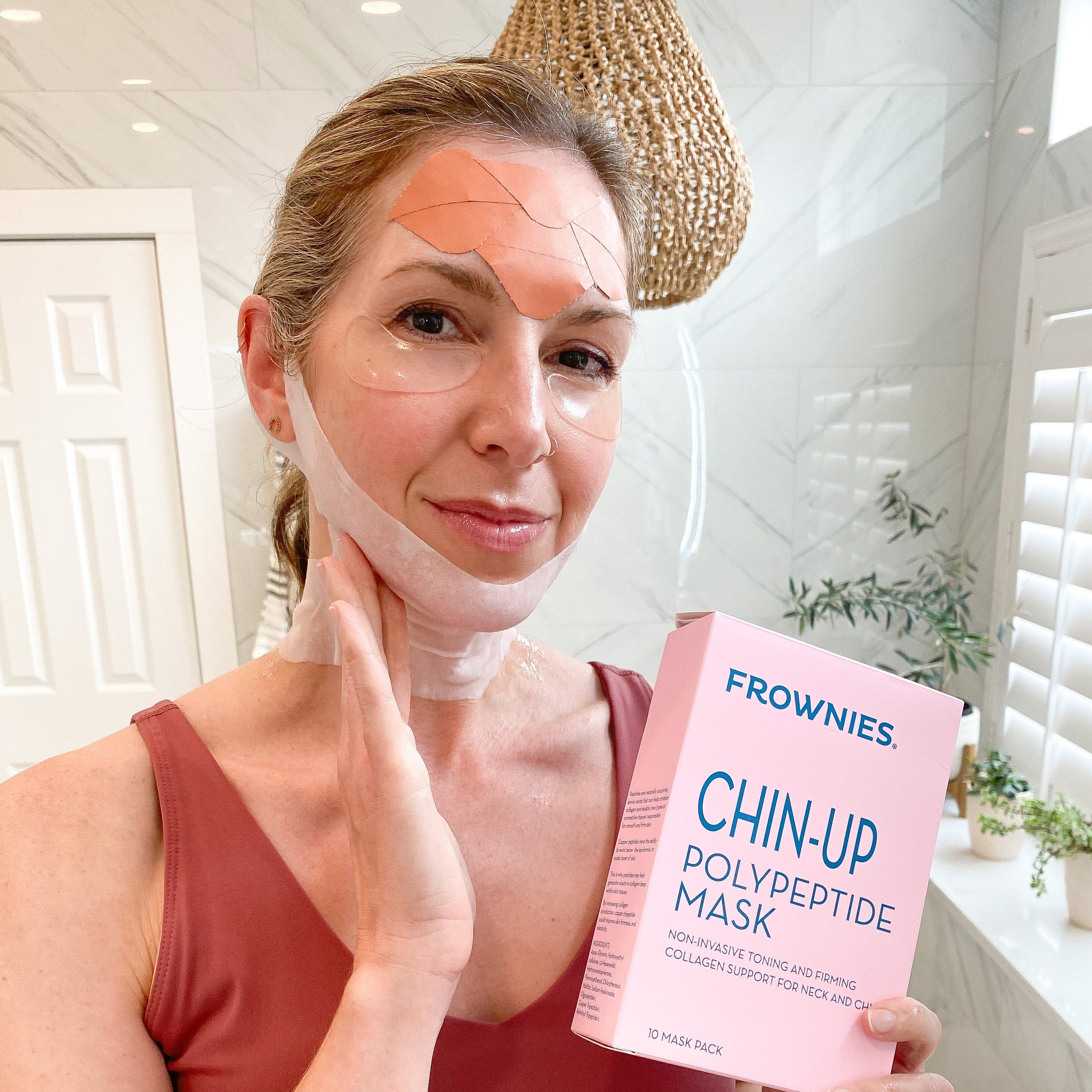 woman wearing frownies facial patches on forehead wrinkles and cactus collagen under eye gels applying CHIN-UP Peptide Neck and Chin Mask  The Frownies   
