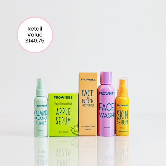 Set of Frownies skincare products including bottles and boxes on a light gray background.