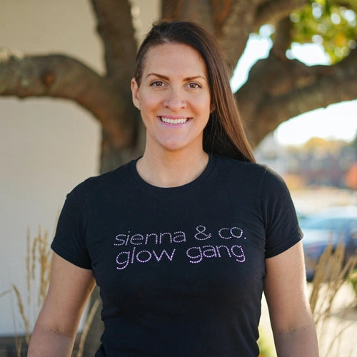 woman in black shirt smiling