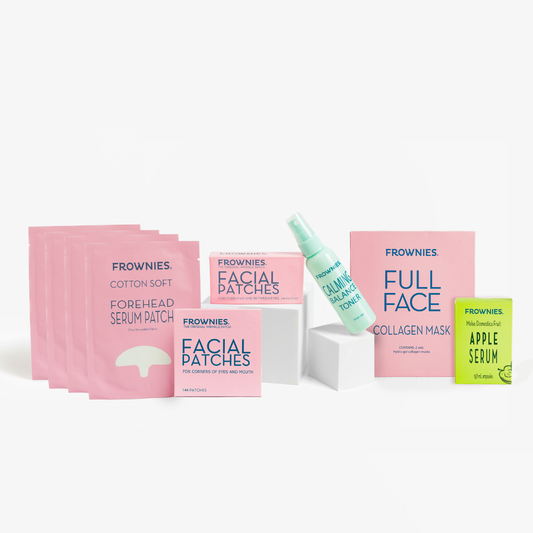 Frownies skincare products including facial patches, collagen mask, serum  patches, and apple serum on a white background