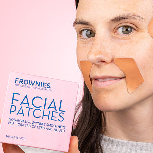 woman holding pink box of frownies facial patches wearing Corners of Eyes & Mouth Wrinkle Patches Facial Patches Frownies   