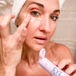 woman in white towel applying Vitamin E Eye Cream Skincare Products Frownies   